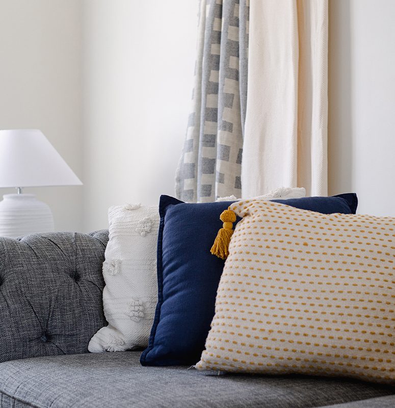 Grey sofa and cushions