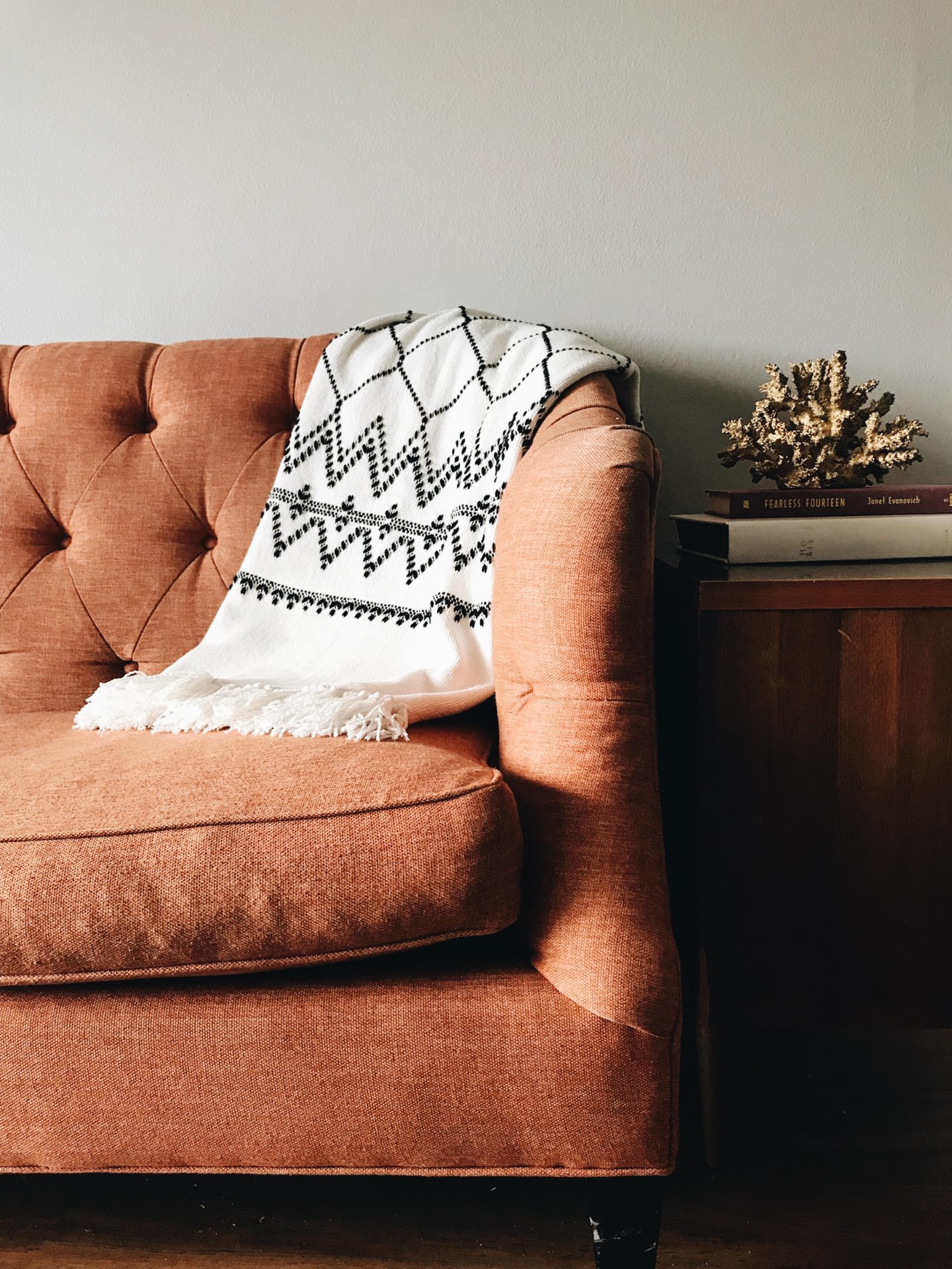 Orange sofa with neutral interior